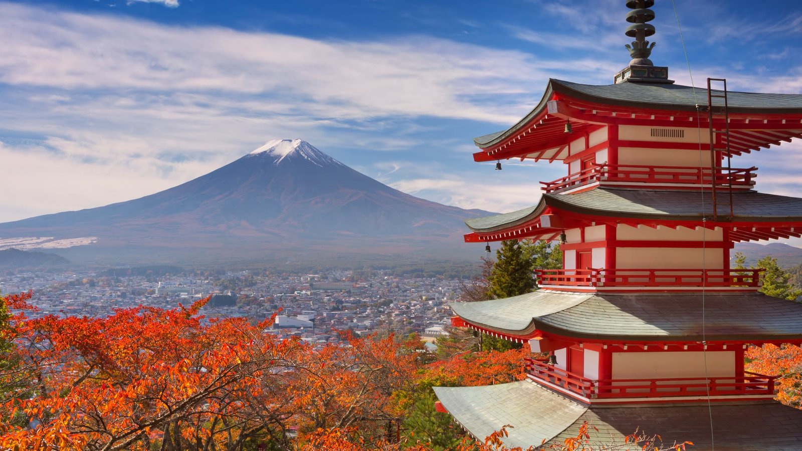 Cherry blossom in front of a pagoda with Mount Fuji behind