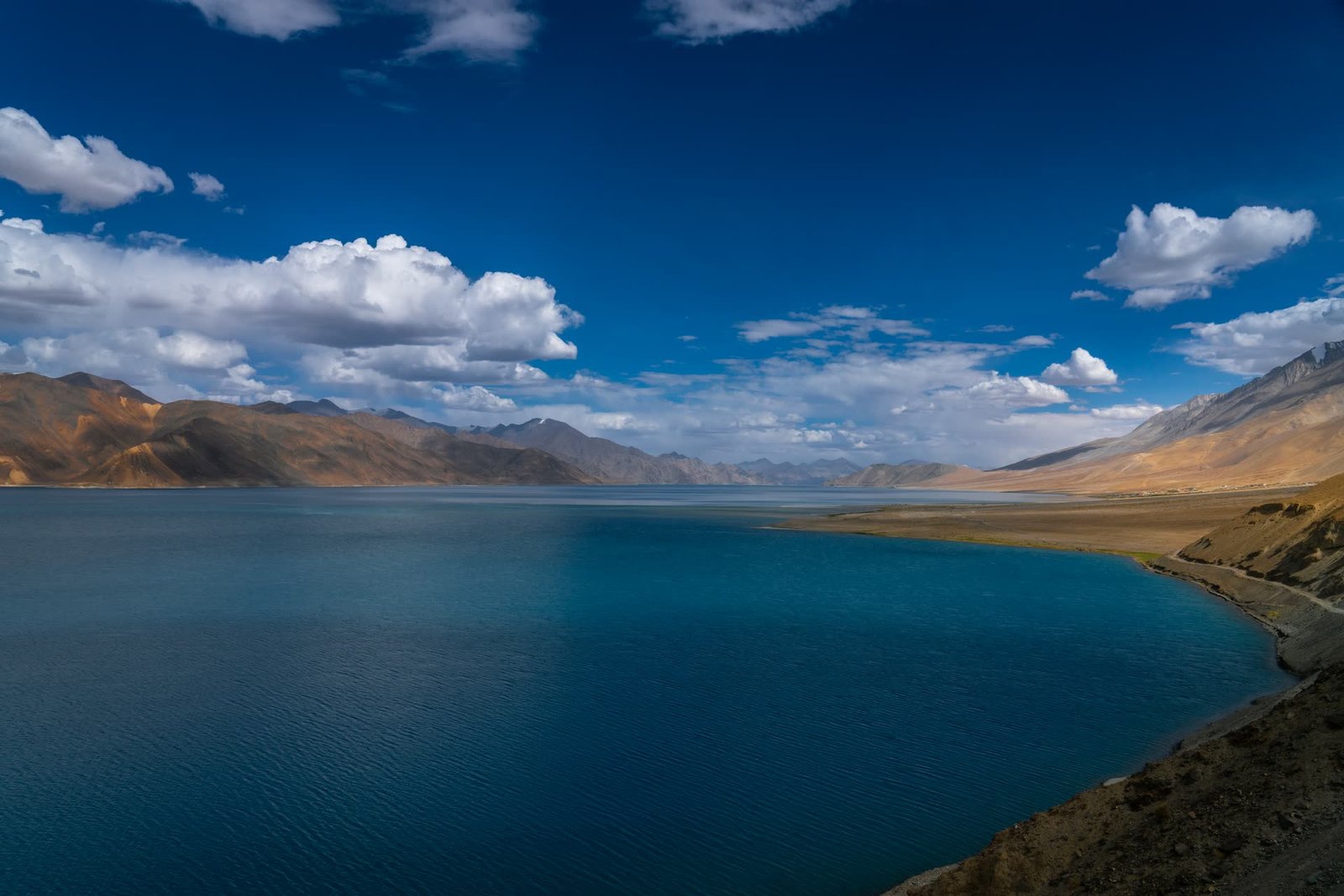 A high-altitude lake between bare mountains in Ladakh